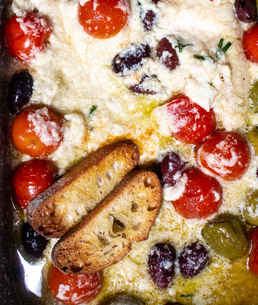 Baked Feta with olives and tomatoes